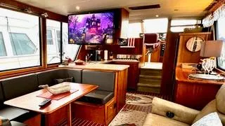  Yacht Photos Pics Luxurious interior of a 2002 Canoe Cove 50 Pilothouse Yacht with elegant furnishings.