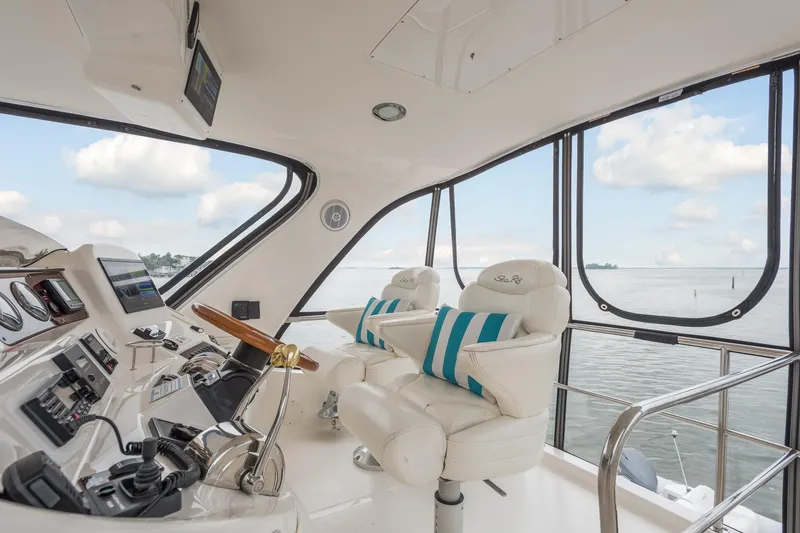 Lattitude Adjustment Yacht Photos Pics Interior of 2003 Sea Ray 480 Sedan Bridge yacht with helm and ocean view.
