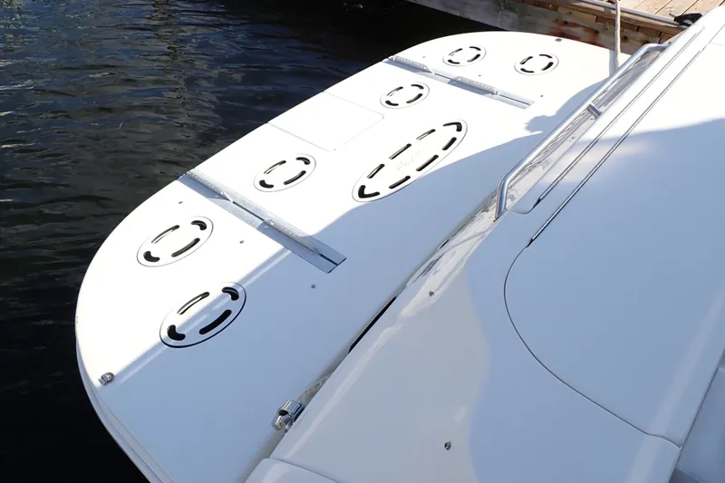 Lattitude Adjustment Yacht Photos Pics 2003 Sea Ray 480 Sedan Bridge swim platform with water backdrop.