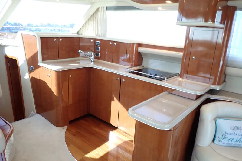 Lattitude Adjustment Yacht Photos Pics Luxurious kitchen interior of 2003 Sea Ray 480 Sedan Bridge yacht.