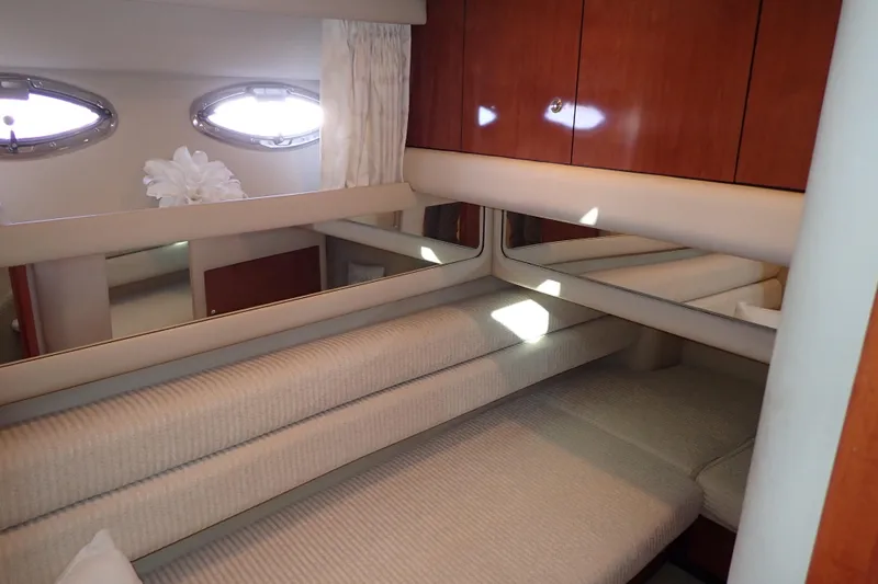 Lattitude Adjustment Yacht Photos Pics Interior of 2003 Sea Ray 480 Sedan Bridge yacht with cozy seating and wooden cabinets.