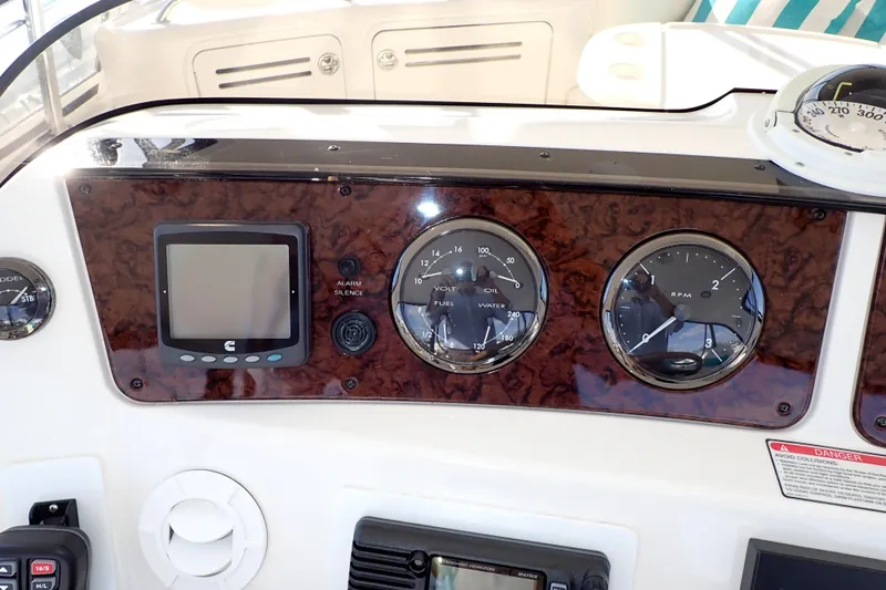 Lattitude Adjustment Yacht Photos Pics Dashboard of 2003 Sea Ray 480 Sedan Bridge with gauges and controls.