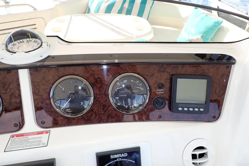 Lattitude Adjustment Yacht Photos Pics Dashboard of 2003 Sea Ray 480 Sedan Bridge with gauges and navigation equipment.