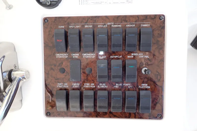 Lattitude Adjustment Yacht Photos Pics Control panel of a 2003 Sea Ray 480 Sedan Bridge yacht with various switches.