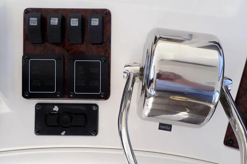 Lattitude Adjustment Yacht Photos Pics Control panel of a 2003 Sea Ray 480 Sedan Bridge yacht with throttle and switches.