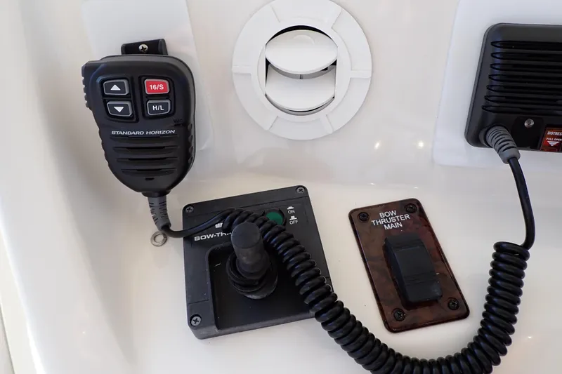 Lattitude Adjustment Yacht Photos Pics Control panel of a 2003 Sea Ray 480 Sedan Bridge with communication and bow thruster controls.