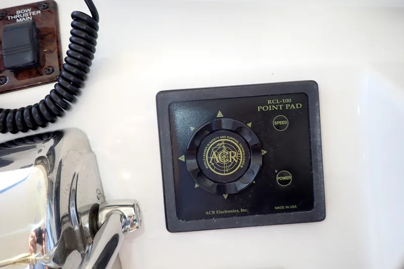 Lattitude Adjustment Yacht Photos Pics Control panel of a 2003 Sea Ray 480 Sedan Bridge with bow thruster and point pad.