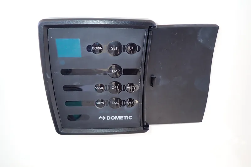 Lattitude Adjustment Yacht Photos Pics Dometic control panel on 2003 Sea Ray 480 Sedan Bridge yacht, featuring temperature and fan settings.