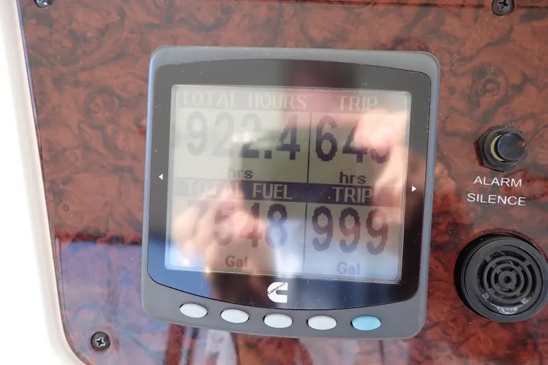Lattitude Adjustment Yacht Photos Pics Dashboard display on 2003 Sea Ray 480 Sedan Bridge showing engine hours and fuel usage.
