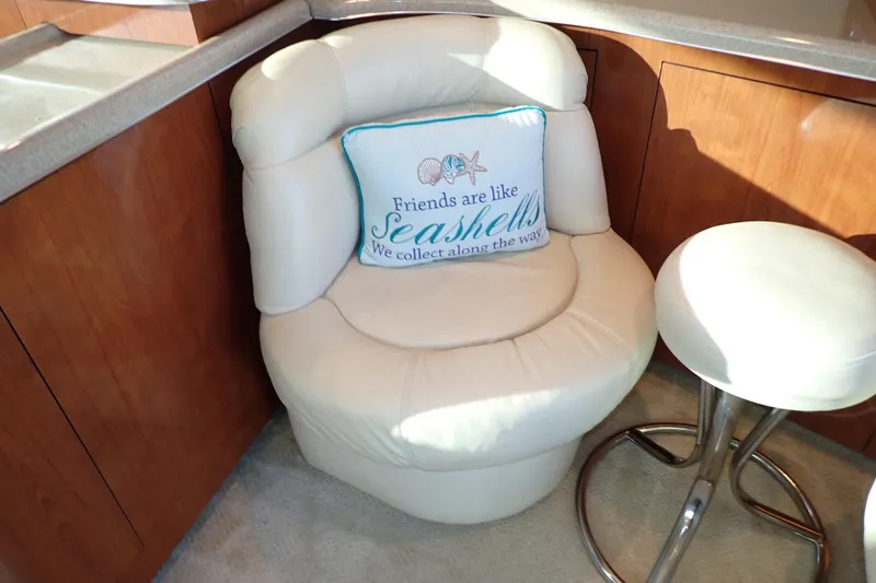 Lattitude Adjustment Yacht Photos Pics Cozy seating area on 2003 Sea Ray 480 Sedan Bridge with decorative seashell pillow.