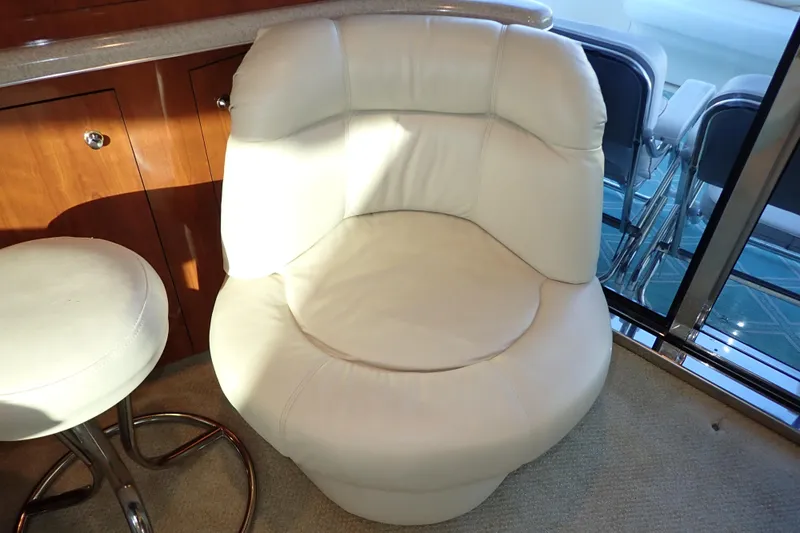 Lattitude Adjustment Yacht Photos Pics Cream leather chair in 2003 Sea Ray 480 Sedan Bridge yacht interior.
