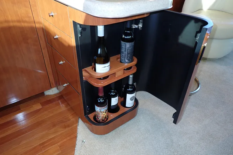 Lattitude Adjustment Yacht Photos Pics Wine storage cabinet in 2003 Sea Ray 480 Sedan Bridge yacht interior.
