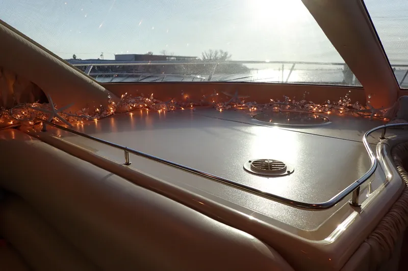 Lattitude Adjustment Yacht Photos Pics Interior of 2003 Sea Ray 480 Sedan Bridge with decorative lights and sunlit view.