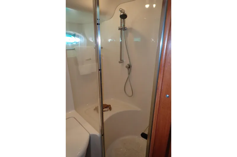 Lattitude Adjustment Yacht Photos Pics Shower area in 2003 Sea Ray 480 Sedan Bridge yacht bathroom.