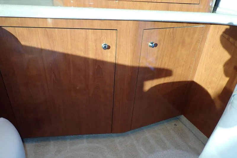 Lattitude Adjustment Yacht Photos Pics Wooden cabinetry on a 2003 Sea Ray 480 Sedan Bridge yacht interior.