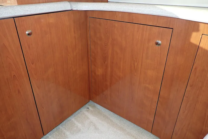 Lattitude Adjustment Yacht Photos Pics Wooden cabinetry in 2003 Sea Ray 480 Sedan Bridge yacht interior.