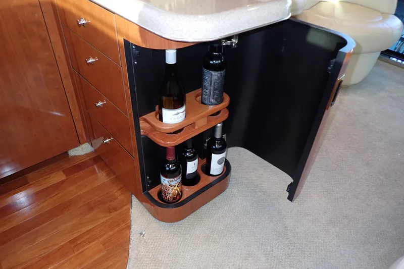 Lattitude Adjustment Yacht Photos Pics Wine storage cabinet in 2003 Sea Ray 480 Sedan Bridge yacht interior.