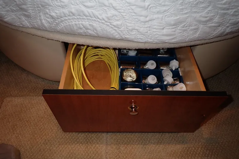 Lattitude Adjustment Yacht Photos Pics Open drawer in 2003 Sea Ray 480 Sedan Bridge, storing cables and small containers.