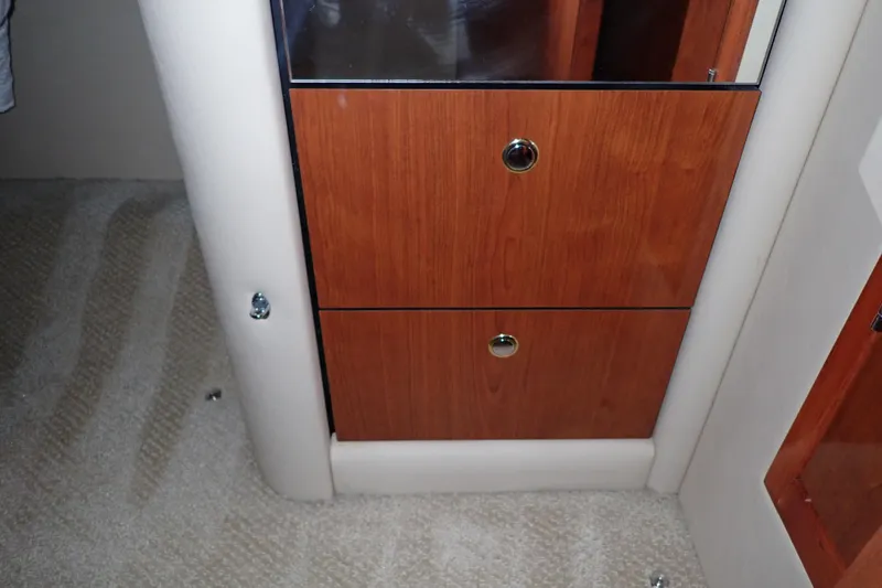 Lattitude Adjustment Yacht Photos Pics Wooden cabinet drawers inside 2003 Sea Ray 480 Sedan Bridge yacht interior.