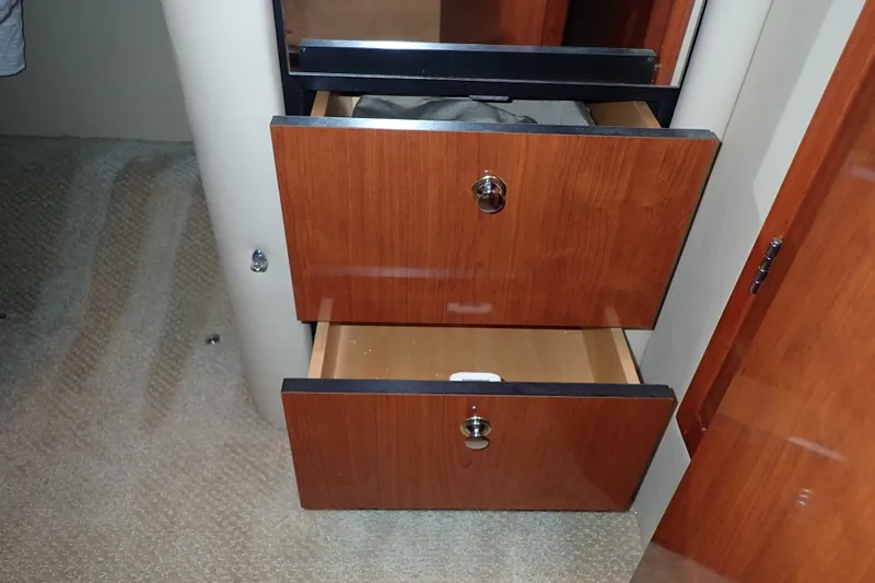 Lattitude Adjustment Yacht Photos Pics Wooden drawers in a 2003 Sea Ray 480 Sedan Bridge yacht interior.