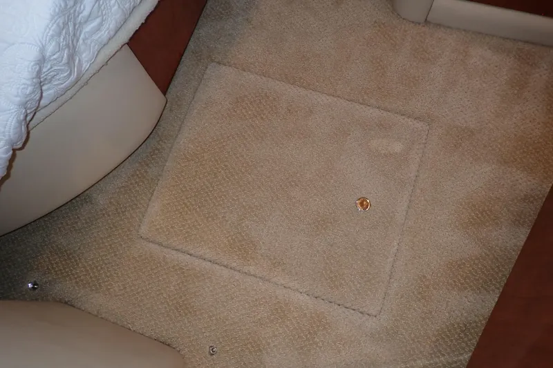 Lattitude Adjustment Yacht Photos Pics Carpeted floor of a 2003 Sea Ray 480 Sedan Bridge yacht interior.
