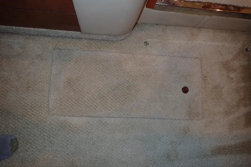 Lattitude Adjustment Yacht Photos Pics Carpeted floor panel on a 2003 Sea Ray 480 Sedan Bridge yacht interior.