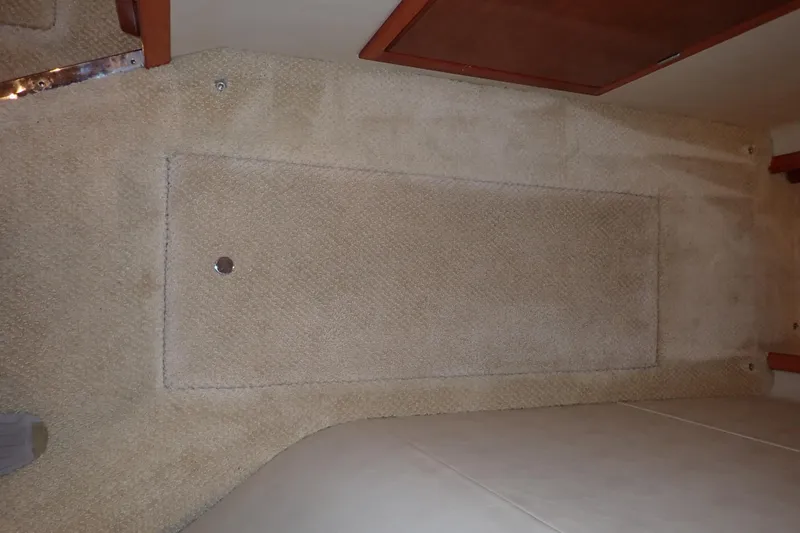 Lattitude Adjustment Yacht Photos Pics Carpeted interior floor of a 2003 Sea Ray 480 Sedan Bridge yacht.