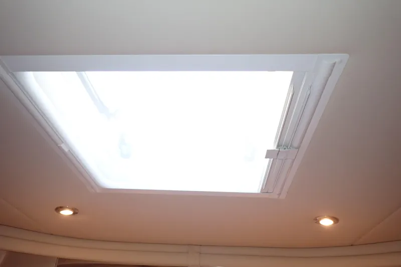 Lattitude Adjustment Yacht Photos Pics Ceiling hatch with lights on 2003 Sea Ray 480 Sedan Bridge yacht.