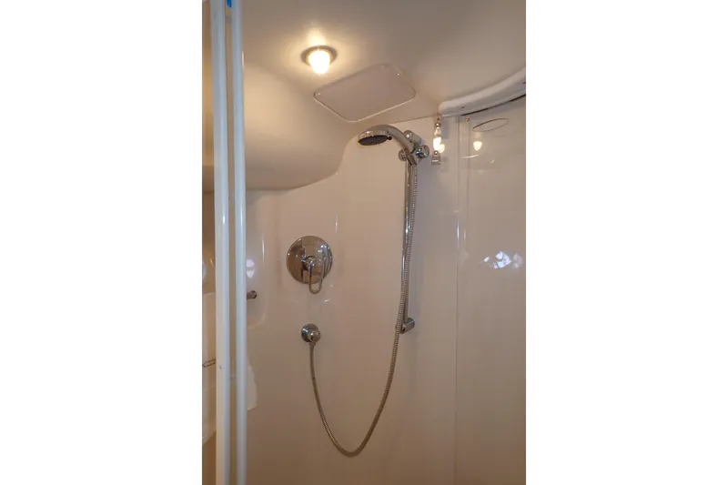 Lattitude Adjustment Yacht Photos Pics Shower area in 2003 Sea Ray 480 Sedan Bridge yacht, featuring modern fixtures.