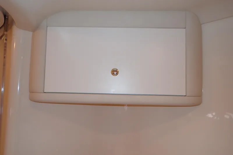 Lattitude Adjustment Yacht Photos Pics White storage cabinet on 2003 Sea Ray 480 Sedan Bridge yacht interior.