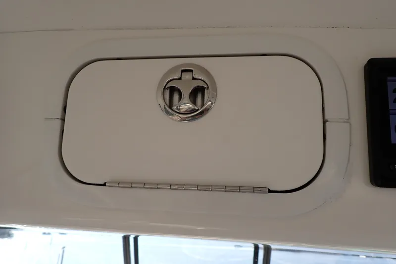 Lattitude Adjustment Yacht Photos Pics Hinged compartment door on 2003 Sea Ray 480 Sedan Bridge yacht interior.