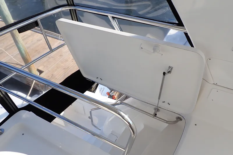 Lattitude Adjustment Yacht Photos Pics 2003 Sea Ray 480 Sedan Bridge yacht with open hatch and stainless steel railings.
