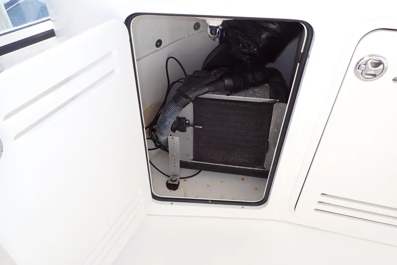 Lattitude Adjustment Yacht Photos Pics Open compartment on 2003 Sea Ray 480 Sedan Bridge showing internal equipment and wiring.