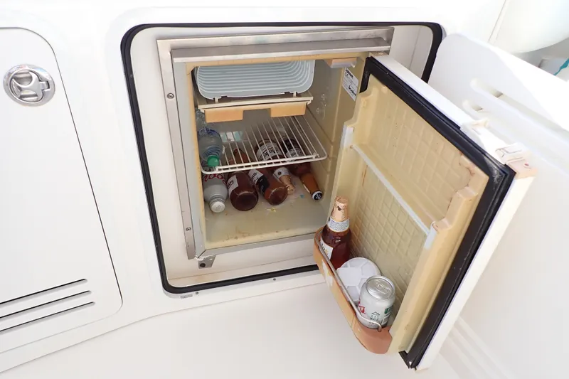 Lattitude Adjustment Yacht Photos Pics Mini fridge on 2003 Sea Ray 480 Sedan Bridge yacht, stocked with beverages.