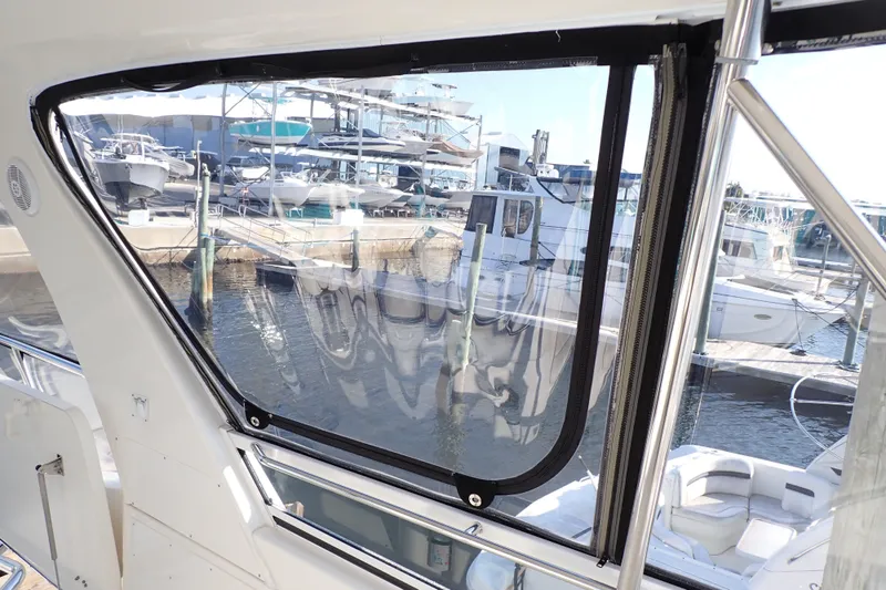 Lattitude Adjustment Yacht Photos Pics 2003 Sea Ray 480 Sedan Bridge interior view with marina backdrop.