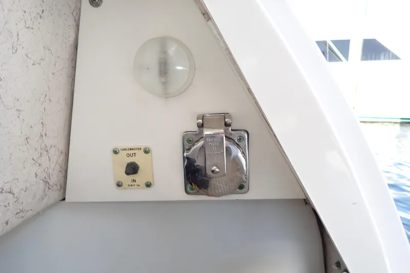 Lattitude Adjustment Yacht Photos Pics 2003 Sea Ray 480 Sedan Bridge electrical panel with cable outlet and light.
