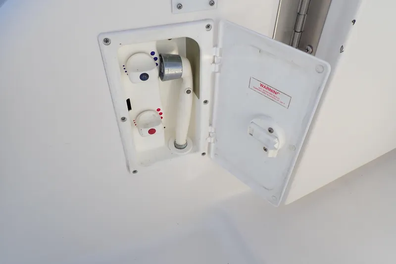 Lattitude Adjustment Yacht Photos Pics 2003 Sea Ray 480 Sedan Bridge water control panel with open access door.