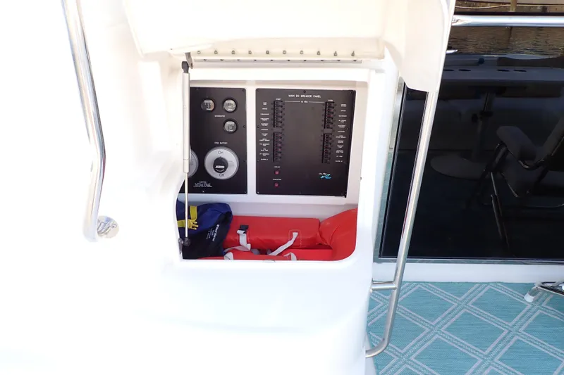 Lattitude Adjustment Yacht Photos Pics Control panel on 2003 Sea Ray 480 Sedan Bridge yacht, featuring switches and safety equipment.