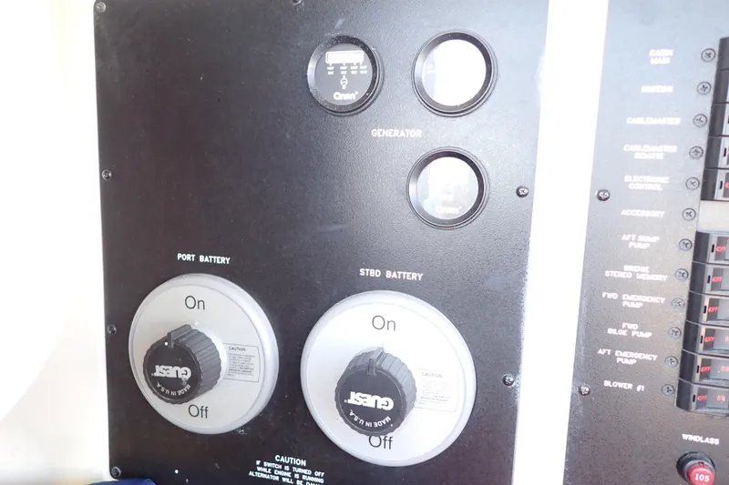 Lattitude Adjustment Yacht Photos Pics Control panel of a 2003 Sea Ray 480 Sedan Bridge with battery switches and gauges.