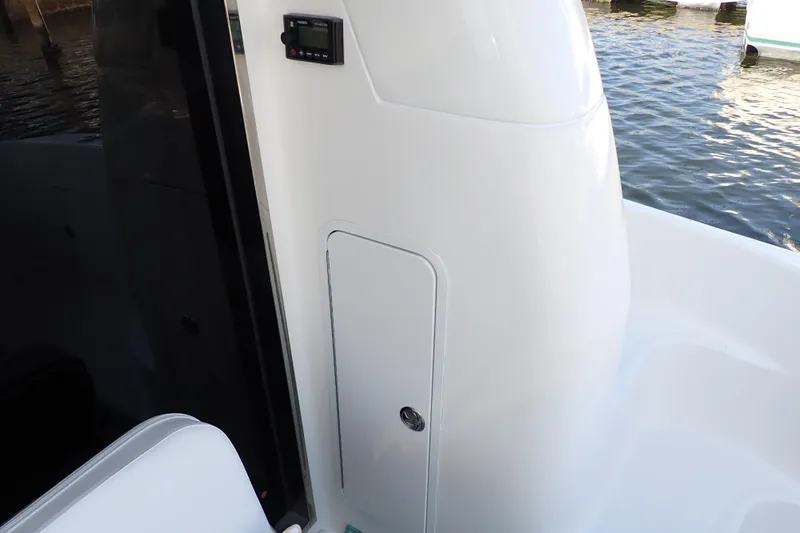 Lattitude Adjustment Yacht Photos Pics 2003 Sea Ray 480 Sedan Bridge boat interior with control panel and storage compartment.