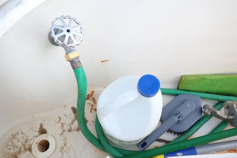 Lattitude Adjustment Yacht Photos Pics Cleaning supplies and hose in a 2003 Sea Ray 480 Sedan Bridge boat.