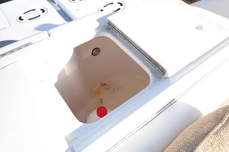 Lattitude Adjustment Yacht Photos Pics Open storage compartment on 2003 Sea Ray 480 Sedan Bridge boat deck.