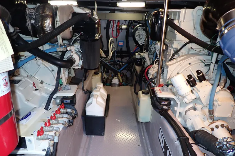 Lattitude Adjustment Yacht Photos Pics Engine room of a 2003 Sea Ray 480 Sedan Bridge yacht, showcasing mechanical components.