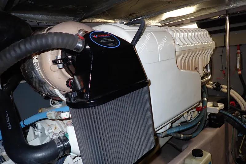 Lattitude Adjustment Yacht Photos Pics Engine compartment of a 2003 Sea Ray 480 Sedan Bridge yacht, showcasing detailed components.