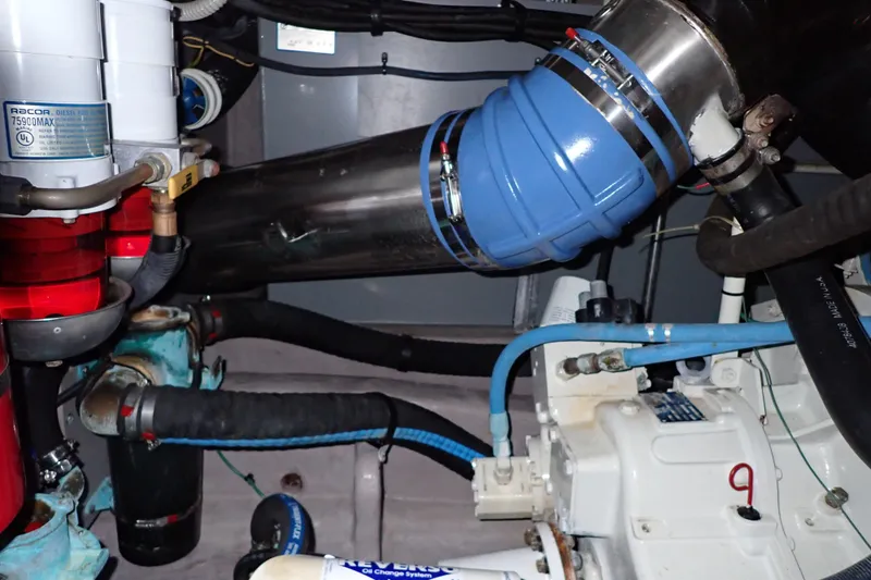 Lattitude Adjustment Yacht Photos Pics Engine room of 2003 Sea Ray 480 Sedan Bridge with visible components and piping.