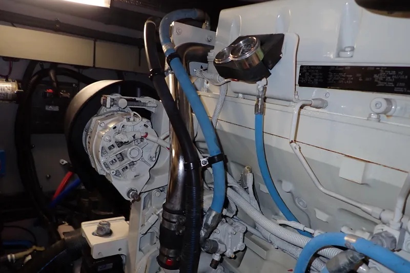 Lattitude Adjustment Yacht Photos Pics Engine compartment of a 2003 Sea Ray 480 Sedan Bridge with visible components and wiring.