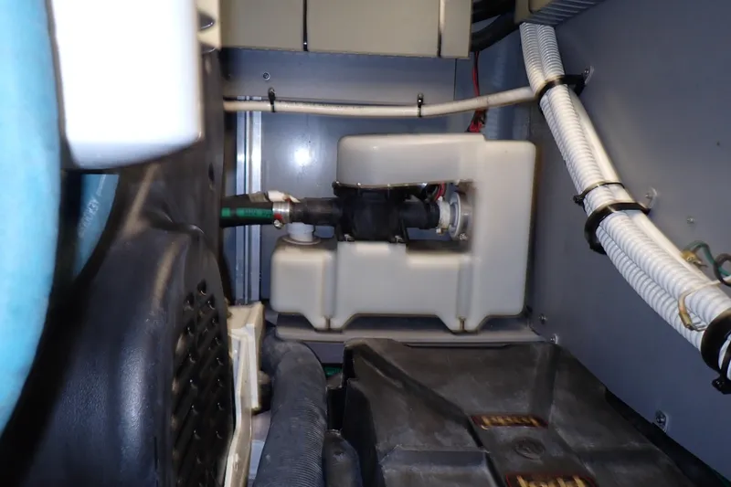 Lattitude Adjustment Yacht Photos Pics Engine compartment of a 2003 Sea Ray 480 Sedan Bridge with visible components and wiring.