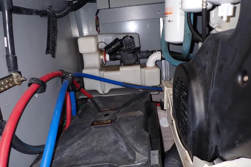 Lattitude Adjustment Yacht Photos Pics Engine compartment of a 2003 Sea Ray 480 Sedan Bridge with visible wiring and components.