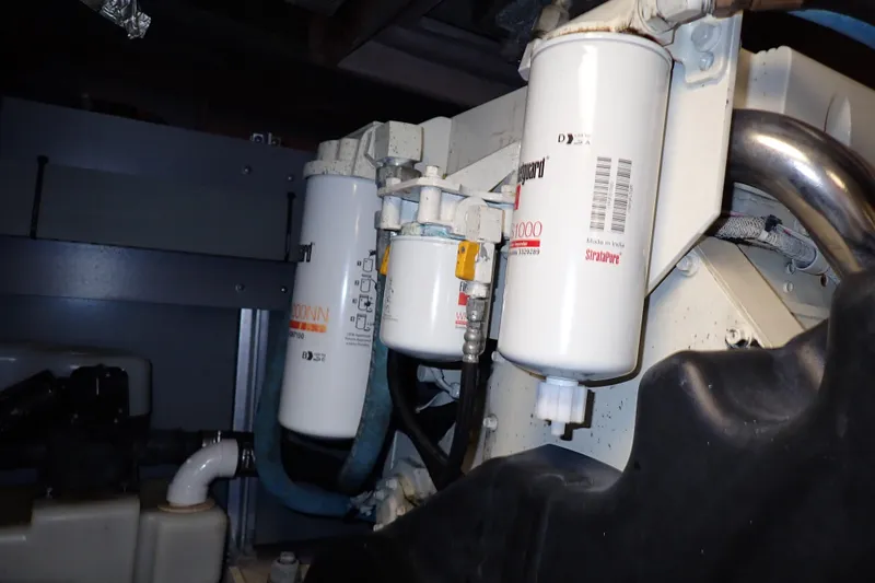 Lattitude Adjustment Yacht Photos Pics Engine compartment of 2003 Sea Ray 480 Sedan Bridge with visible fuel filters.