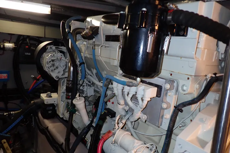 Lattitude Adjustment Yacht Photos Pics Engine room of 2003 Sea Ray 480 Sedan Bridge yacht, showcasing mechanical components.